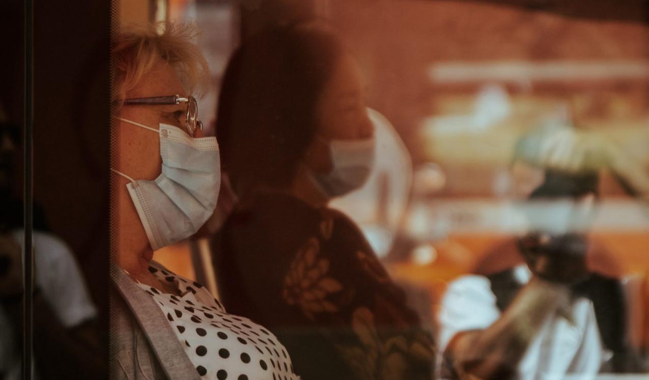 Women on a bus wearing facemasks. Credit: Gender and Covid-19 Working Group