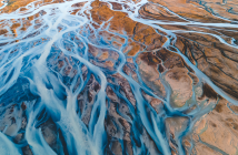 Aerial photograph of intersecting river streams from Icelandic glaciers. ©rybarmarekk/shutterstock