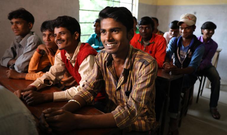 Men smiling in Raniganj, Bihar, India. © Paula Bronstein/Getty Images/Images of Empowerment