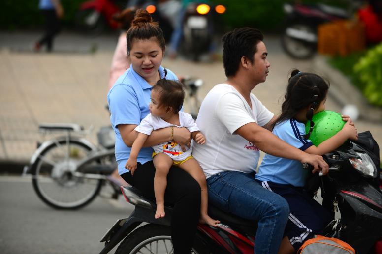 A Vietnamese family of four on a motorbike. © Thanh Tung/Institute for Studies of Society, Economy and Environment