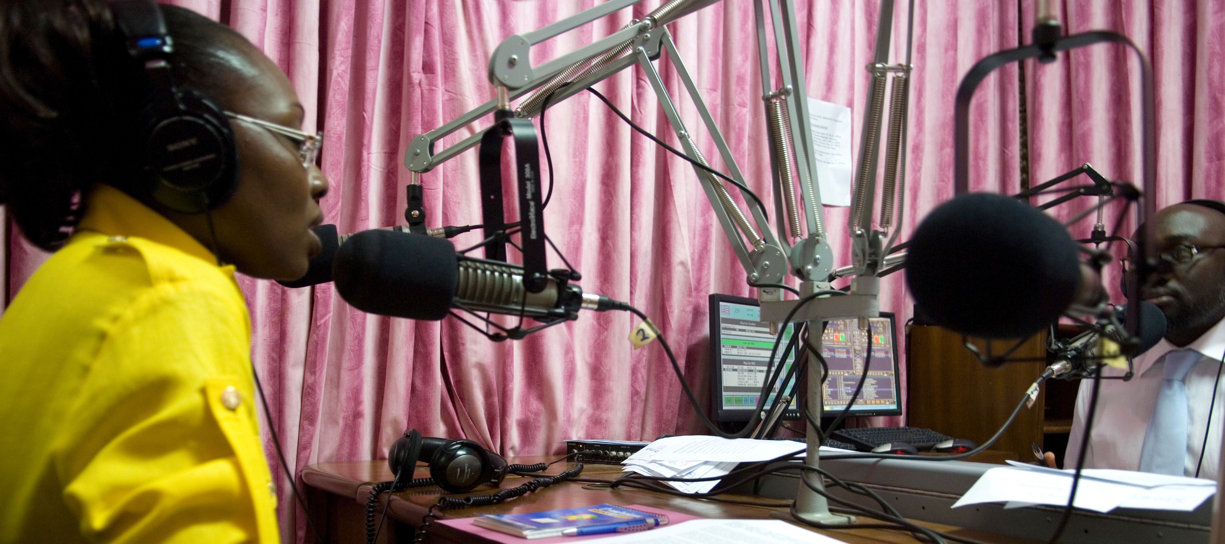 Morning radio show host Komla Dumor works in his sound booth at the Joy FM studio in Accra, Ghana. © Jonathan Ernst / World Bank