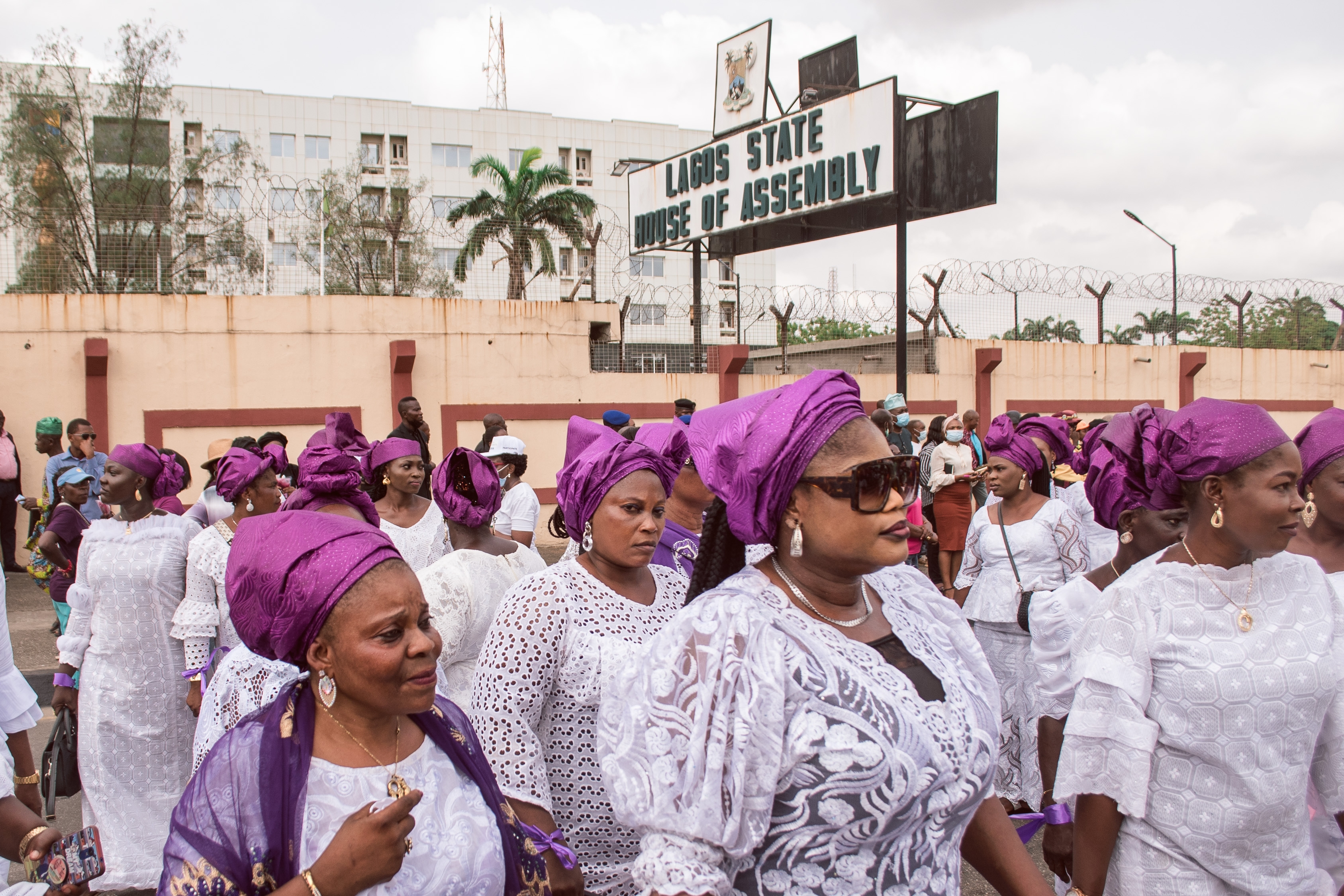 Women wearing purple and white outfits at a protest rally in response to the government's rejection of a gender equality bill.  Lagos, Nigeria, March 2022. © Tolu Owoeye | Shutterstock ID: 2150255357
