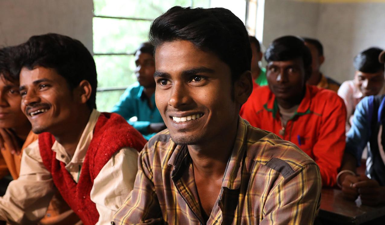 Men smiling in Raniganj, Bihar, India. © Paula Bronstein/Getty Images/Images of Empowerment