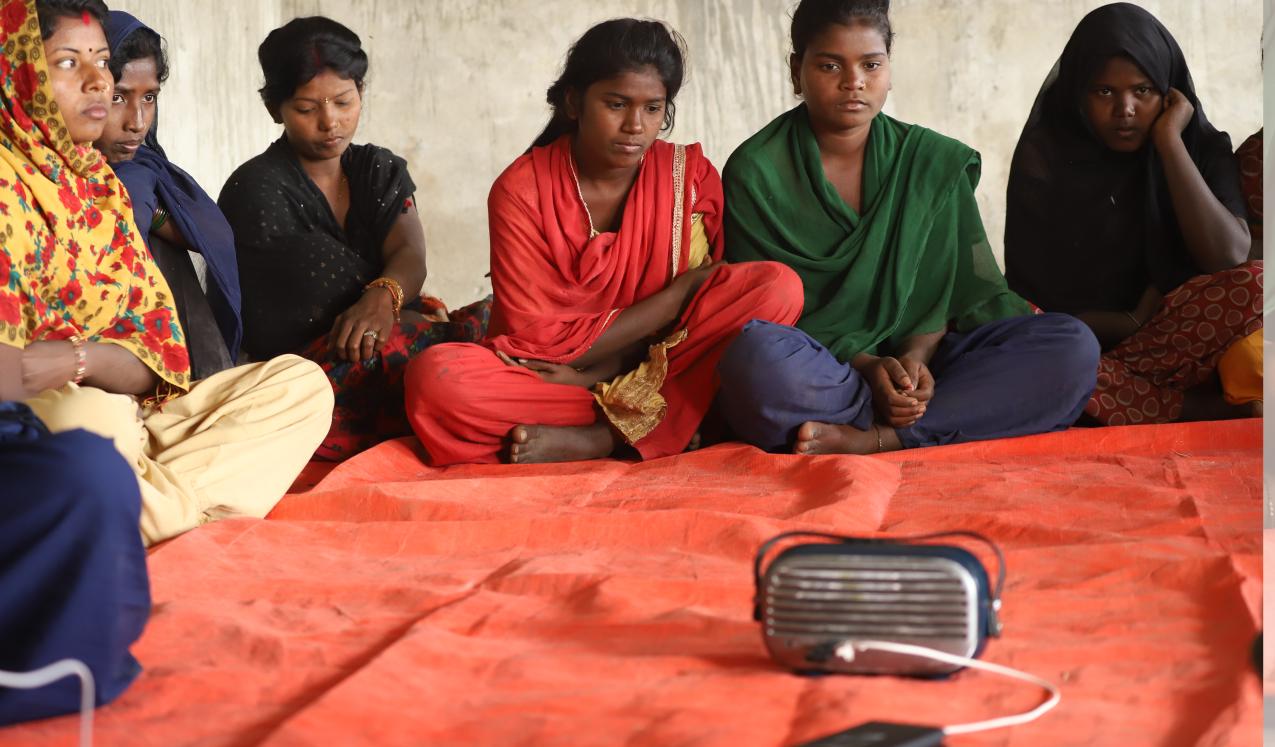 Girls in Eastern Terai, Nepal meet twice a week to listen PMC's 'Hilkor (Ripples in water)' Drama. The drama covers the story of child marriage and gender based violence.  ©PMC