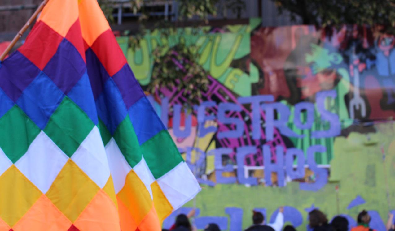 A Wiphala Andean Indigenous Flag at the International Women's Day march in Santiago de Chile, 8 March 2022. © Emilie Tant