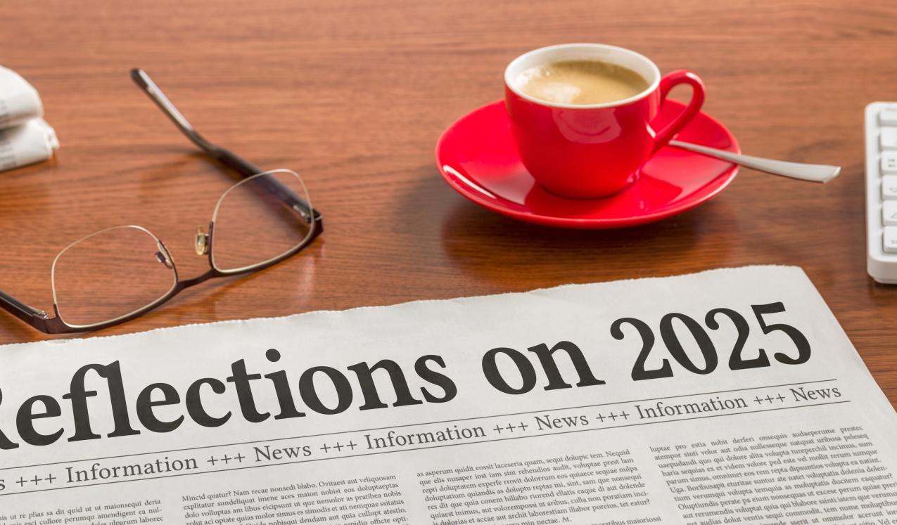 A newspaper on a wooden desk - Reflections on 2025 © Zerbor | Shutterstock ID: 2707617607