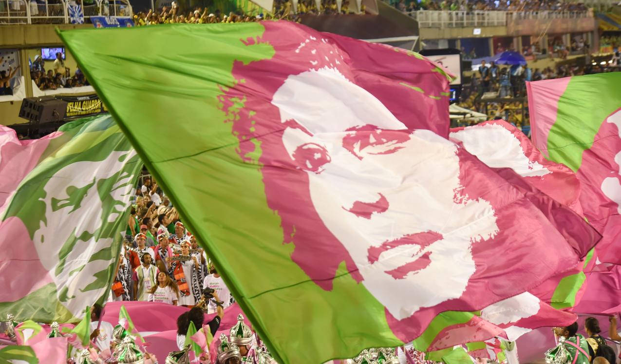 Flags of murdered Brazilian politician, Marielle Franco, waved during the Rio de Janeiro Carnival. Brazil, 2019. © Shutter Photo Press | Shutterstock
