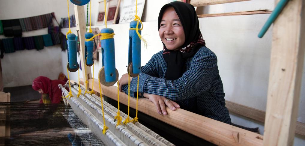 Sughira, 16-years-old, works at weaving silk on a loom at a carpet and silk weaving centre in Herat Citadel Afghanistan. Copyright: World bank