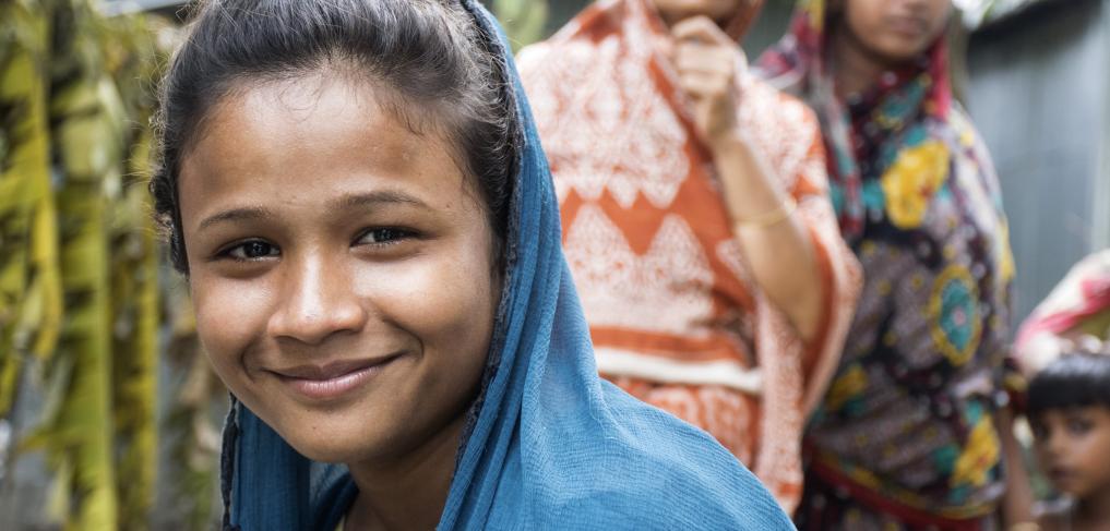 A young girl smiles for the camera at the Maternal and Child Welfare Center, in Narsingdi, Bangladesh. © Rama George-Alleyne/World Bank