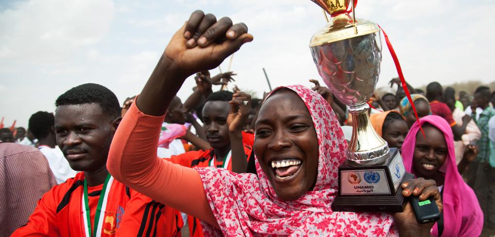 A woman celebrates the closing ceremony of a football competition in Zam Zam camp for internally displaced persons (IDPs) in El Fasher, North Darfur. ©UN Photo/Albert González Farran