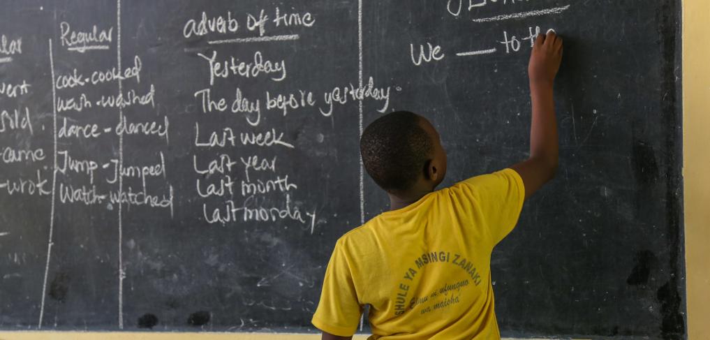 At student writing on a board. © Sarah Farhat / World Bank ID: 20170317-Tanzania-Farhat-8282