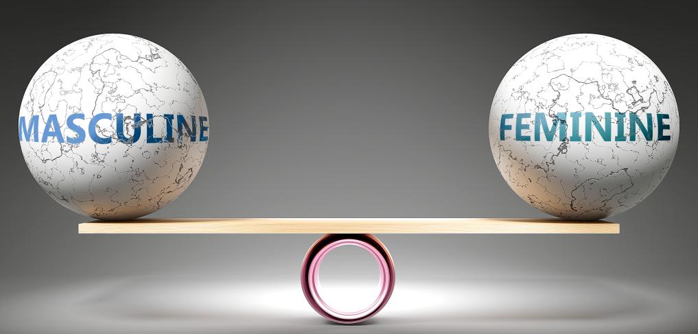 Masculine and feminine in balance - pictured as balanced balls on scale © GoodIdeas/Shutterstock/1589741737