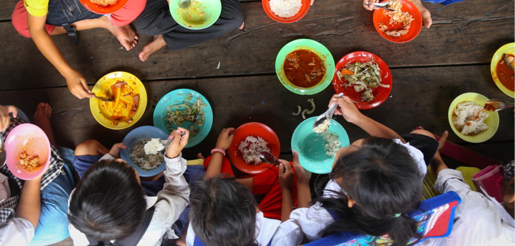 Children having lunch in asian school sitting on the floor ©Anna Issakova/shutterstock