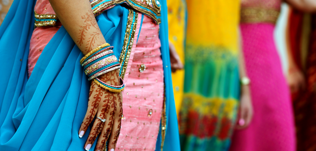 A young women's hand with henna tattoos and a diamond ring. ©infinity21/shutterstock