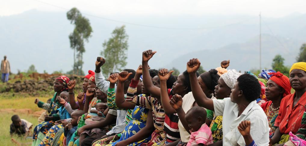 Women and children at a village meeting near Kigali, Rwanda. © Subhrajit123 / Shutterstock ID: 2011588205