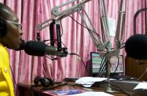 Morning radio show host Komla Dumor works in his sound booth at the Joy FM studio in Accra, Ghana. © Jonathan Ernst / World Bank