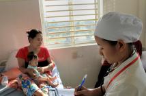 A mother and child at a health centre in Preah Vihear province, Cambodia. © Chhor Sokunthea / World Bank