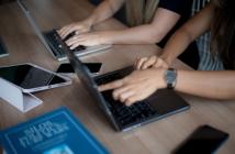 A close up of two laptops with hands working on them. © UN Women/Ploy Phutpheng/DSC_4884