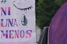 #NiUnaMenos Placard with eye and tear drop painting