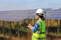 A young woman engineer checking solar panel at solar power plant © Monthira | Shutterstock ID: 786784237