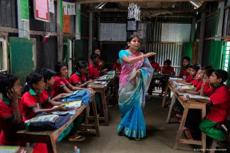 Students listening to their teacher in Sahabatpur village, Bangladesh © Dominic Chavez/World Bank