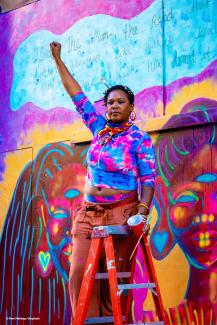 An artist raises her hand to 'Celebrate and Protect' march in New York. © Stephen A. Schwarzman/Unsplash