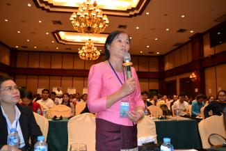 A participant asking a question at the Laos convening