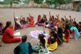 Children take part in an activity about reproductive health