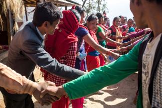 Participants shake hands at a pragati event