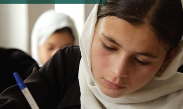 Girl with pen in classroom