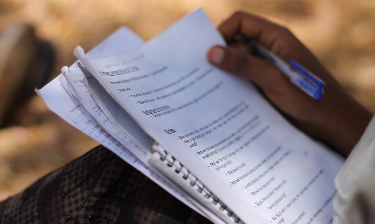 A girl completes an exam paper