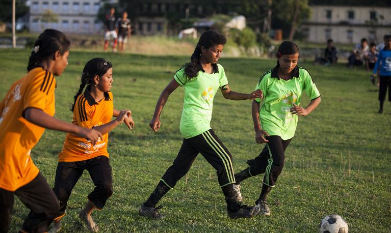 Girls playing football in Nepal