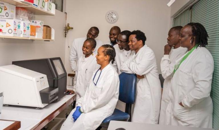 Doctors looking at a machine