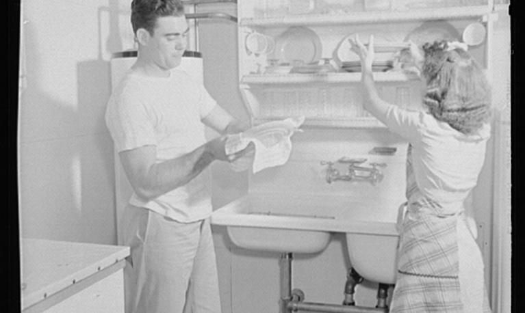 “The Smiths share the drudgery of housework, for they both have important war jobs,” the Office of War Information wrote about this photo circa 1944. Credit Library of Congress