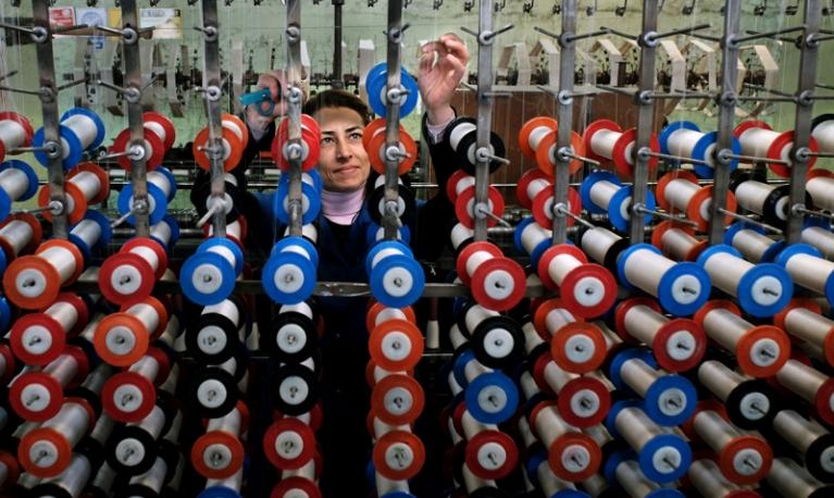 A worker at a silk thread factory in Turkey. Photo: Bulent Suberk, 2016 CGAP Photo Contest