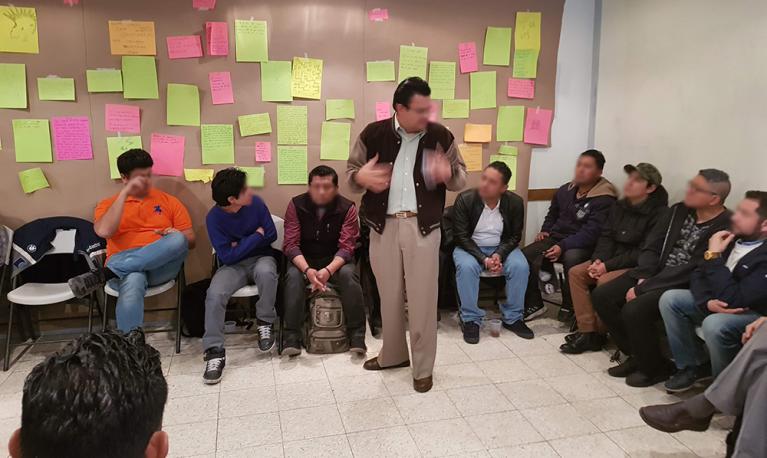 Men attending a group session about violence against women. Credit: Gendes