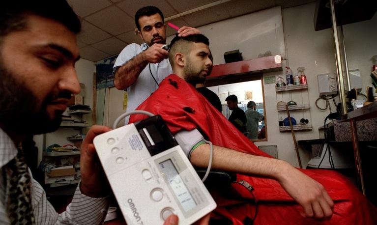 Health checks for men at a barbers’ shop in Bradford UK. © Bradford Health of Men project