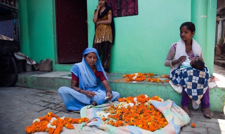 An Indian family outside their home. Photo: Graham Crouch / World Bank