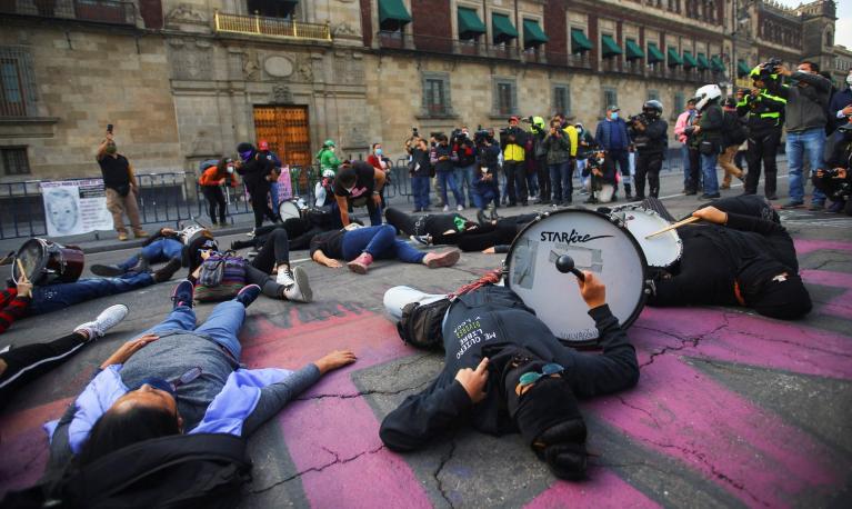 Women take part in a demonstration to demand justice for victims of gender violence and femicides, outside the National Palace in Mexico City. © Edgard Garrido/Reuters