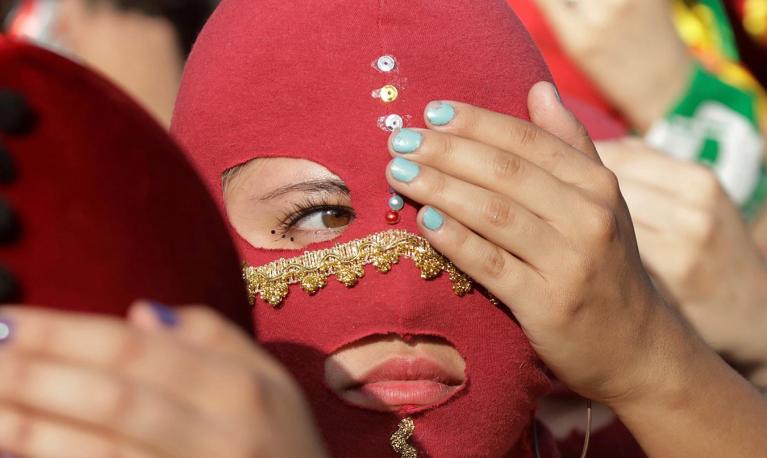 Here women wearing masks take part in a protest against gender violence in Santiago, Chile, on December 6, 2019. REUTERS/Andres Martinez Casares