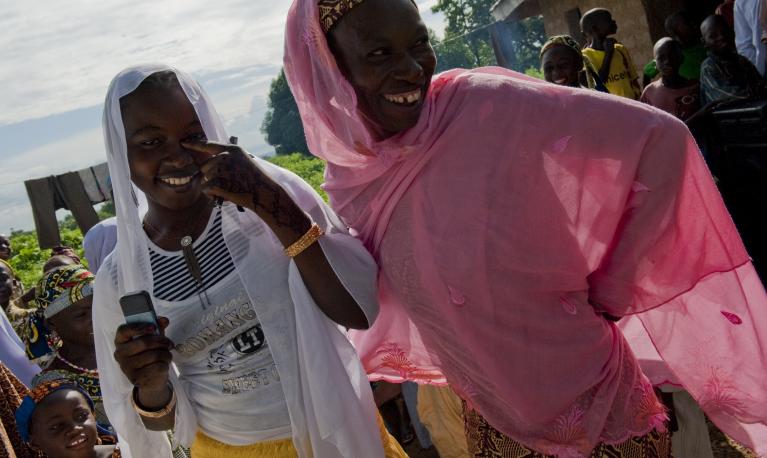 Two laughing women in Takalafiya-Lapai village in Niger State, Nigeria. 