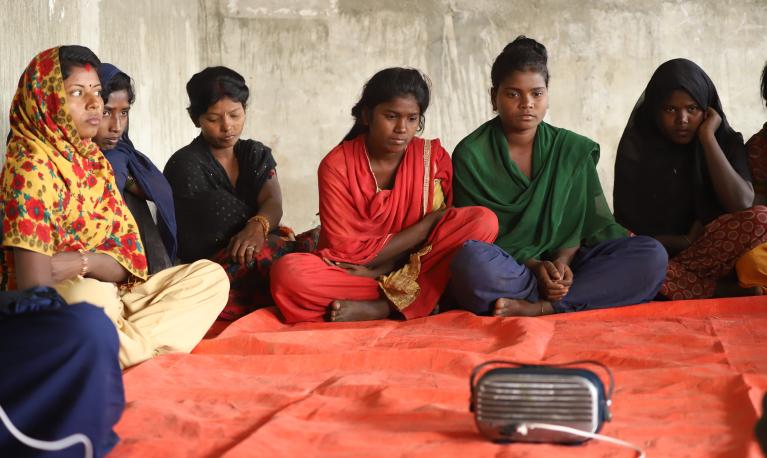 Girls in Eastern Terai, Nepal meet twice a week to listen PMC's 'Hilkor (Ripples in water)' Drama. The drama covers the story of child marriage and gender based violence.  ©PMC