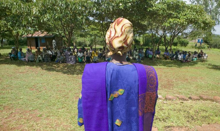  Sarah Kilemi, wife of Parliament member Kilemi Mwiria, speaks to "Women without Husbands" who have been ostracized from society. Meru, Kenya, 2007. © Shutterstock/Joseph Sohm ID:105700322
