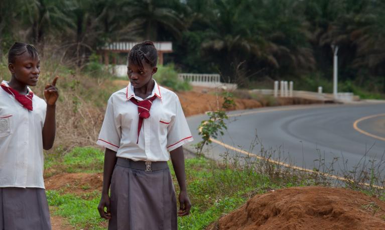 Girls returning from school near Freetown, Sierra Leone. ©robertonencini | Shutterstock ID: 460865203