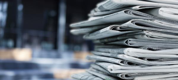 Pile of fresh newspapers. © Billion Photos/Shutterstock/1665903517