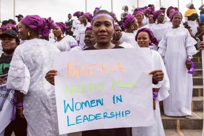 A woman at a protest rally in response to the government's rejection of a gender equality bill, holds a sign saying 'Nigeria needs more women in leadership'. Lagos, Nigeria, March 2022. © Tolu Owoeye | Shutterstock ID: 2150255371