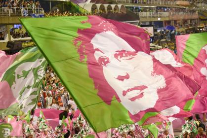 Flags of murdered Brazilian politician, Marielle Franco, waved during the Rio de Janeiro Carnival. Brazil, 2019. © Shutter Photo Press | Shutterstock