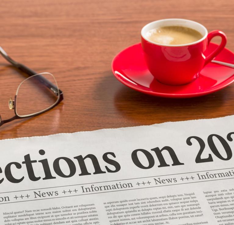 A newspaper on a wooden desk - Reflections on 2025 © Zerbor | Shutterstock ID: 2707617607