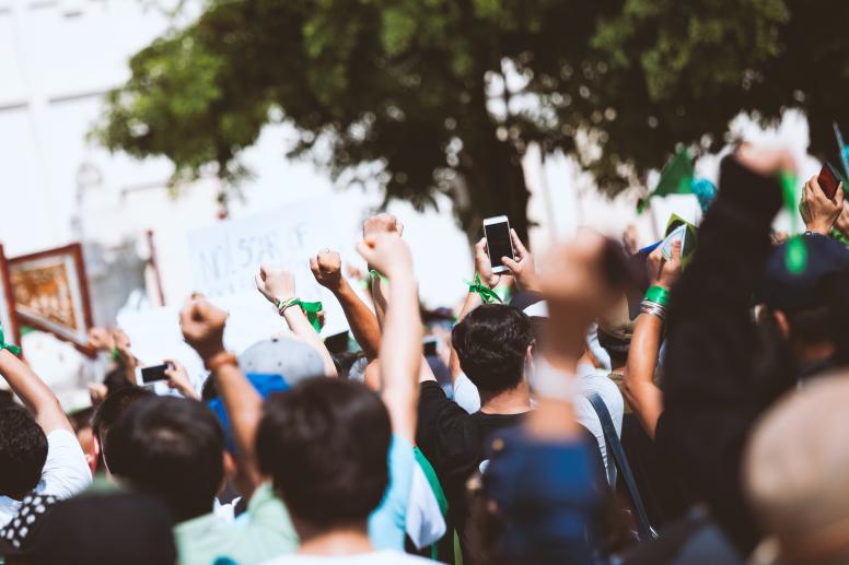 Campaigners wearing green wrist bands in support of LGBTQI+ rights ©GLIDE