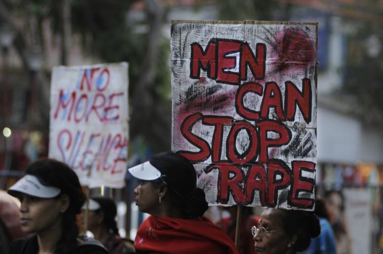 Women during a rally with signs saying ‘men can stop rape’ in Kolkata on 16 December 2016. Credit: arindambanerjee/Shutterstock.com